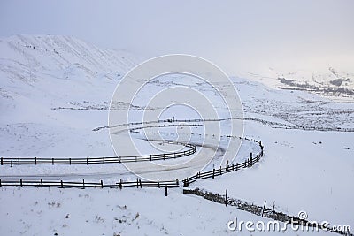 Twisty Road in the snow on a mountain Stock Photo