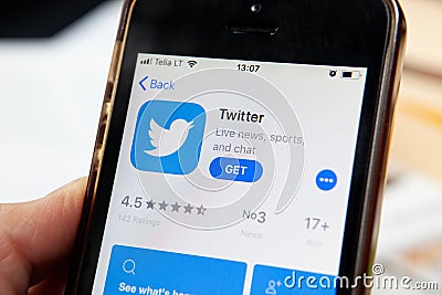 Twitter app on app store. IPhone with a social media app. Editorial Stock Photo