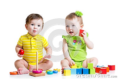 Two adorable kids playing with toys. Toddlers girl Stock Photo