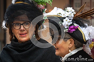 Two adult women in medieval carnival costumes in Venice Editorial Stock Photo