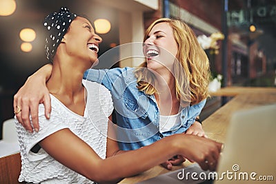 Two affectionate multiracial women friends Stock Photo