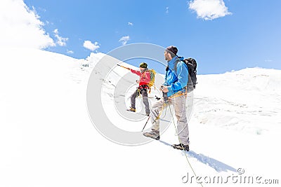Two alpinists friends walking climbing ice glacier mountain Andes Peru Stock Photo