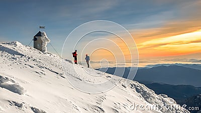 Two alpinists talking on the top of the Triglav mountain. Editorial Stock Photo