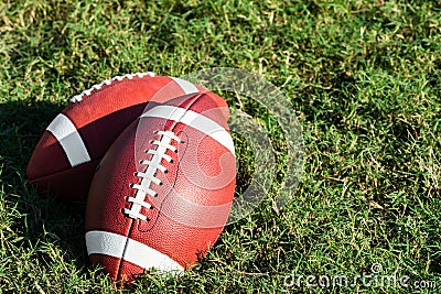 Two American College High School Junior Football on Grass Stock Photo