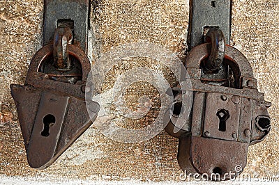 Two ancient rusty padlocks with keyhole Stock Photo