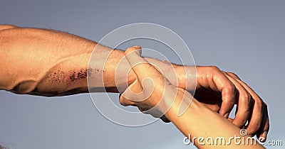 Two arms on blue sky Stock Photo