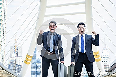 Two asian business have victory of business goal with building a Stock Photo