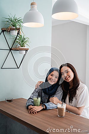 Asian muslim woman bestfriend together in cafe Stock Photo