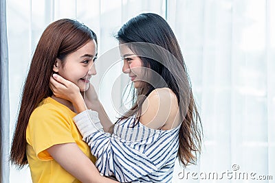 Two Asian women looking at each others in home. People and lifestyles concept. LGBT pride and lesbian theme Stock Photo