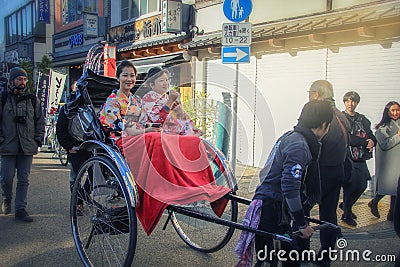 Two Asian women in rickshaw tour in Asakusa Editorial Stock Photo