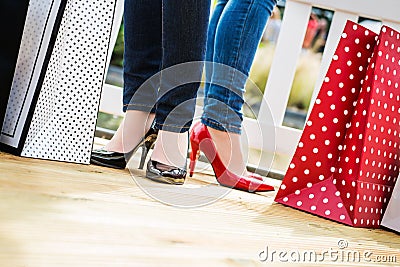 Two attractive young female friends enjoying a break after succesfull shopping Stock Photo