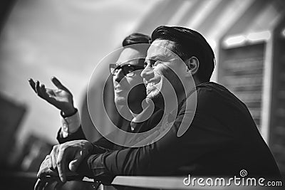 Two awesome business man have a rest between a work. Stock Photo