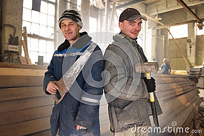 Two bad unskilled builder workers Stock Photo