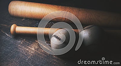 Two baseballs and bats on wooden desk Stock Photo