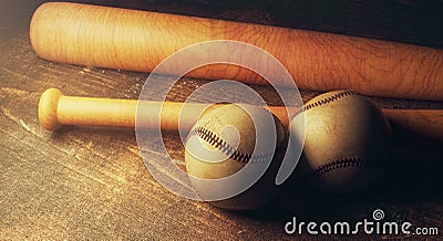 Two baseballs and bats on wooden table Stock Photo