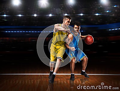 Two basketball players in scrimmage during basketball match Stock Photo