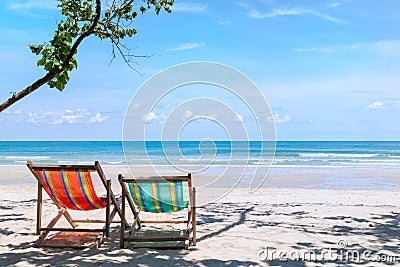 Two beach chairs on the sandy beach near the sea at Koh Chang Th Stock Photo