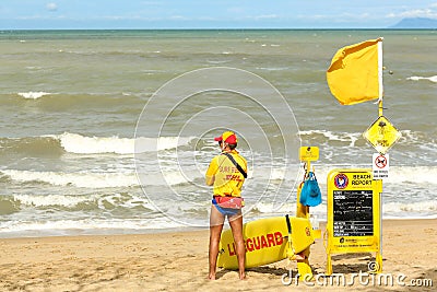 Two beach lifesavers in a surf patrol cart. Editorial Stock Photo