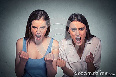 Two beautiful angry women screaming Stock Photo