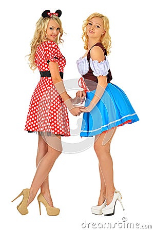 Two beautiful blonde women in carnival costumes Stock Photo