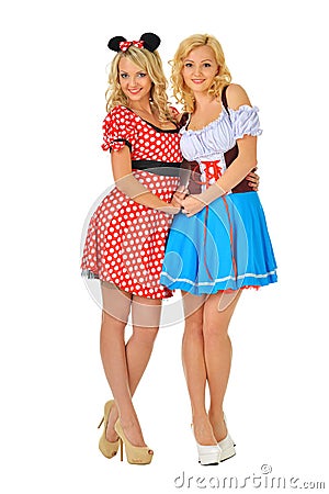 Two beautiful blonde women in carnival costumes Stock Photo