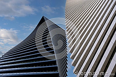 Close-up beautiful geometric background of two modern high-rise buildings side by side Editorial Stock Photo