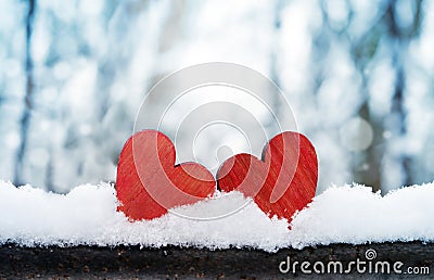 Two beautiful romantic vintage red hearts together on a white snow winter background. Love and St. Valentines Day concept Stock Photo