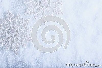 Two beautiful sparkling vintage snowflakes on a white frost snow background. Winter and Christmas concept Stock Photo