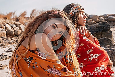 Two beautiful stylish boho models outdoors Stock Photo