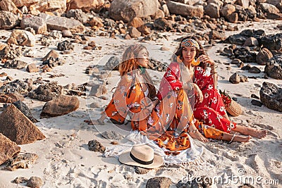 Two beautiful stylish boho models outdoors Stock Photo