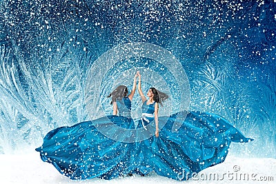 Two beautiful women dancing in fairy tale forest Stock Photo