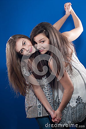 https://thumbs.dreamstime.com/x/two-beautiful-young-women-friends-dancing-together-23748264.jpg