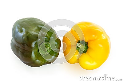 Two bell peppers, green and yellow, laying on a flat surface, isolated on white background with a clipping path Stock Photo