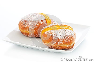 Two Berliner with egg creme on a plate Stock Photo