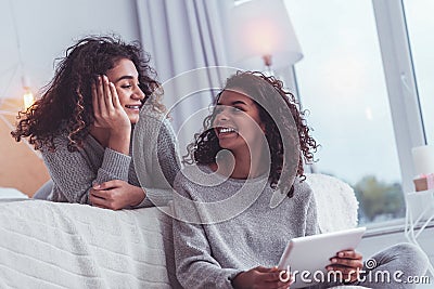 Two best friends having good mood while chatting with each other Stock Photo