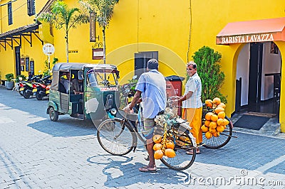 Two bicyclers in Galle Editorial Stock Photo