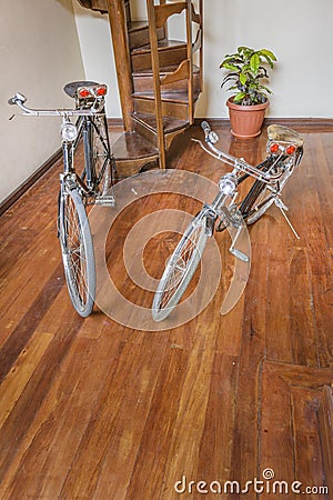 Two Bicylcles Parked at Interior Room Stock Photo