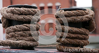 Two big bollard and hawser Stock Photo