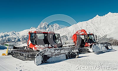 Two big red ratrak in the hill mountains Stock Photo