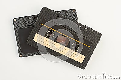 Two black cassettes on white background. Stock Photo