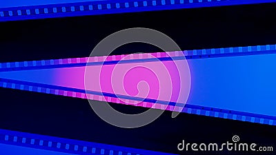 Two black film strips on blue background close up. 35mm film slide frame. Copy space. Stock Photo