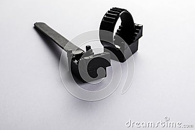 Two black wire clamps on a white background Stock Photo