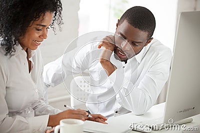 Two black workers discussing business ideas in office Stock Photo