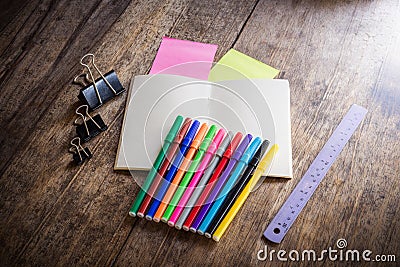 two blank colorful sticky notes , notebook ,pencil ,highlighter, clip, Magic Colors, ruler Stock Photo