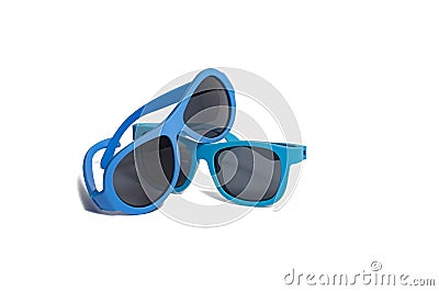 Two blue children`s sunglasses on a white background Stock Photo