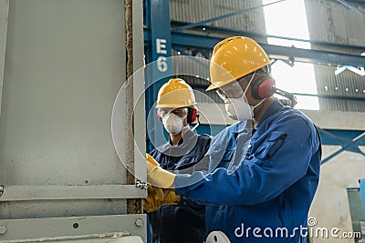 Two blue-collar workers wearing protective equipment Stock Photo