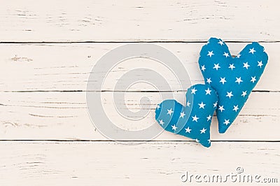 Two blue hearts on white wooden background Stock Photo