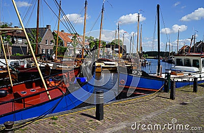 Two blue ships in the historical harbour fo Spakenburg Editorial Stock Photo