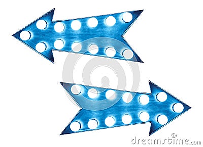 Two blue vintage bright and colorful illuminated metallic display arrow signs with light bulbs Stock Photo