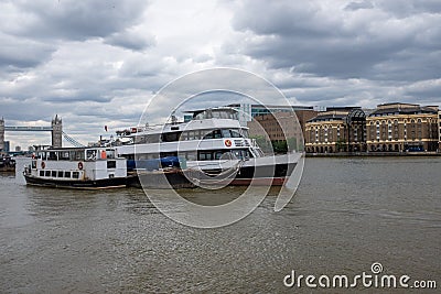 Two boats in the river themes, cloudy sky above. Editorial Stock Photo